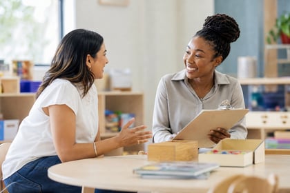 Preschool Director and Teacher Connecting in Early Childhood Setting